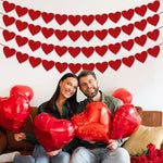 Partyprops pre-strung forty-eight hearts banner set laid flat to showcase the premium felt material texture.