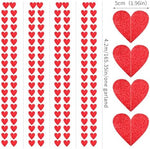 Close up view of the glittery texture on the imported red heart streamer banner.