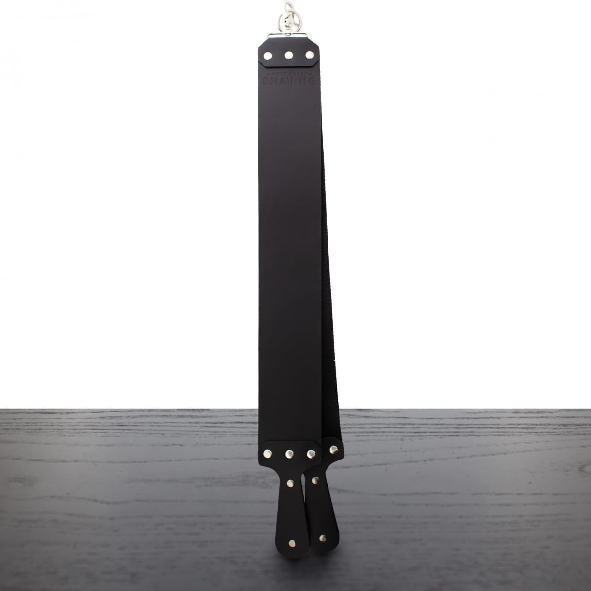West Coast Shaving 3 Inch Hanging Strop front view showing the premium black top grain leather side for straight razor alignment.