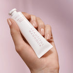 Estée Lauder 1.0 Ounce moisturizing hand cream packaging highlighting the floral ingredients