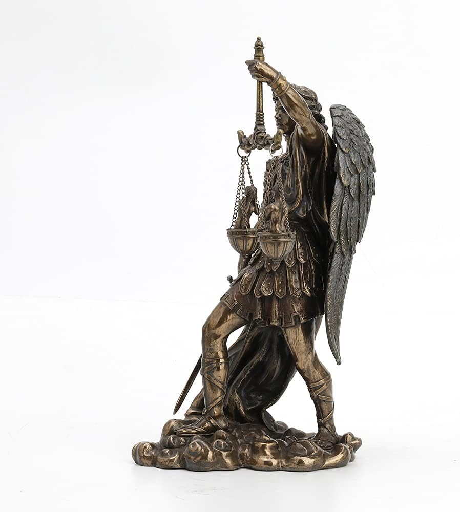 Close up view of the scales of justice and sword held by the archangel.