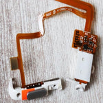 The complete flexible copper ribbon connector extended for the classic media player repair.
