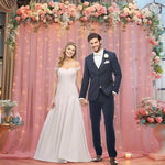 Side perspective of the installed dusty rose backdrop drape showing realistic hanging volume and depth