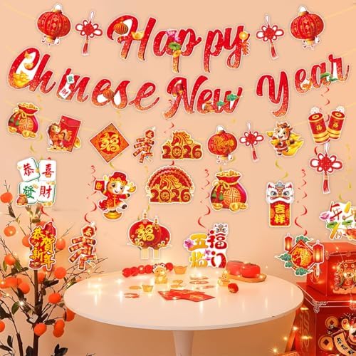 Close up view of the traditional red paper lanterns and gold metallic hanging swirls included in the festive party kit.