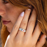 OreilleStar motivational Let Them spinner ring displayed on a woman's thumb showcasing its lifestyle fit.