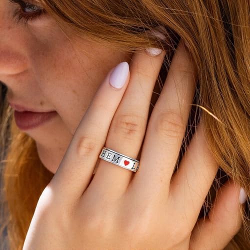 OreilleStar motivational Let Them spinner ring displayed on a woman's thumb showcasing its lifestyle fit.