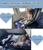 JUELWRY portable travel bed for kids folded compactly next to its convenient navy blue storage bag.