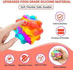 RadBizz multicolor sensory toy ball held in a hand illustrating its portable size.