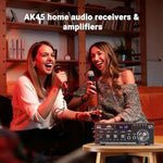 Neohipo compact karaoke power amplifier with microphone plugged into the front panel input jack.