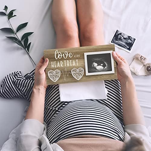 Farmhouse style wooden ultrasound photo frame displayed on a white nursery room shelf