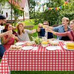 Disposable red plaid tablecloths for outdoor picnic setup
