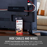 Renter friendly hook and loop cable hider mounted vertically on a living room wall
