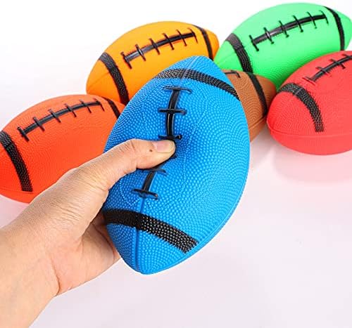 A child easily gripping the lightweight six inch waterproof inflatable football toy with one hand
