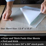 Four thick transparent backing sheets protecting a completed one thousand piece puzzle