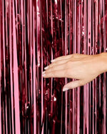 Deep wine red metallic foil backdrop panel close up highlighting the extra shiny reflective texture