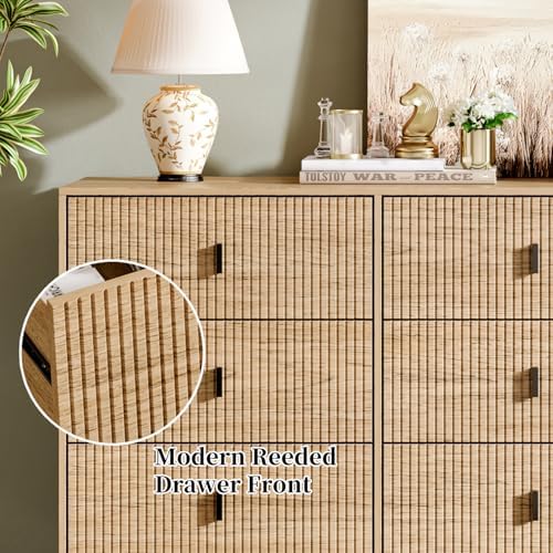 Chrangmay 9 drawer dresser styled in a modern bedroom