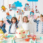 Metallic foil hanging swirls reflecting light in a decorated birthday room