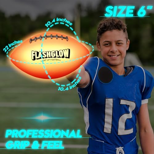 Flashglow impact activated glowing football being thrown by a teenager outdoors