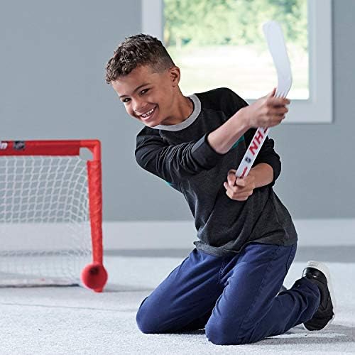 Franklin Sports NHL player stick and ball set being unboxed for an indoor sports game.