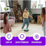 Action shot of a kid kicking the rechargeable air floating soccer game across a tiled living room floor