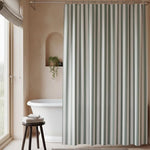 Close up view of the sage green and white striped pattern on the waterproof fabric