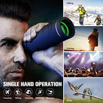 Waterproof outdoor monocular telescope with integrated protective lens cover resting on a camping surface