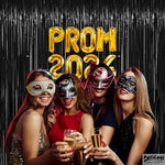 Elegant black streamers used as a dramatic doorway decoration backdrop for a bachelor party or graduation bash.