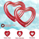 Two red heart shaped inflatable swim rings by Sumind
