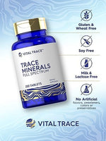 Carlyle Vital Trace Minerals dietary supplement bottle standing on a neutral lifestyle background