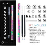 Colorful decompression toy pen disassembled into individual magnetic pieces and metallic balls on a desk
