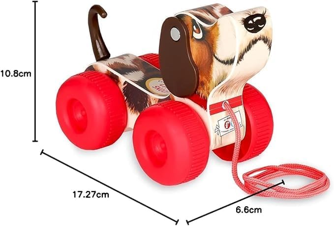 Toddler walking with the imported Fisher Price classic dog toy on a wooden floor.