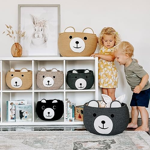 Light brown woven animal basket filled with soft baby toys and blankets.