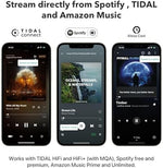 WiiM Mini wireless stereo player next to a smartphone displaying the companion mobile application.