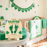 Close up of laser engraved 3D clover detailing on the baby milestone wooden sign