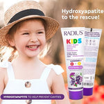 Texture of Radius kids super duper immunity toothpaste on a toothbrush.