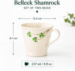 Close-up view of hand-painted green shamrocks on Belleek Parian china mug