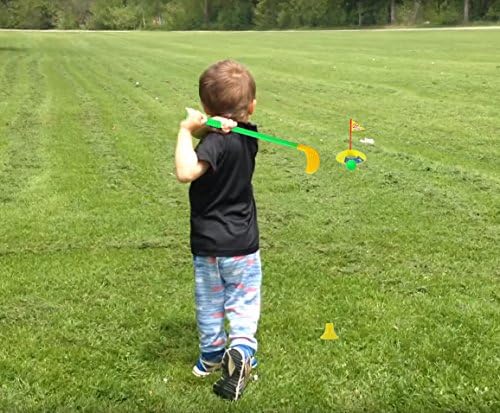 Toddler holding an Orzizro plastic golf club for size reference