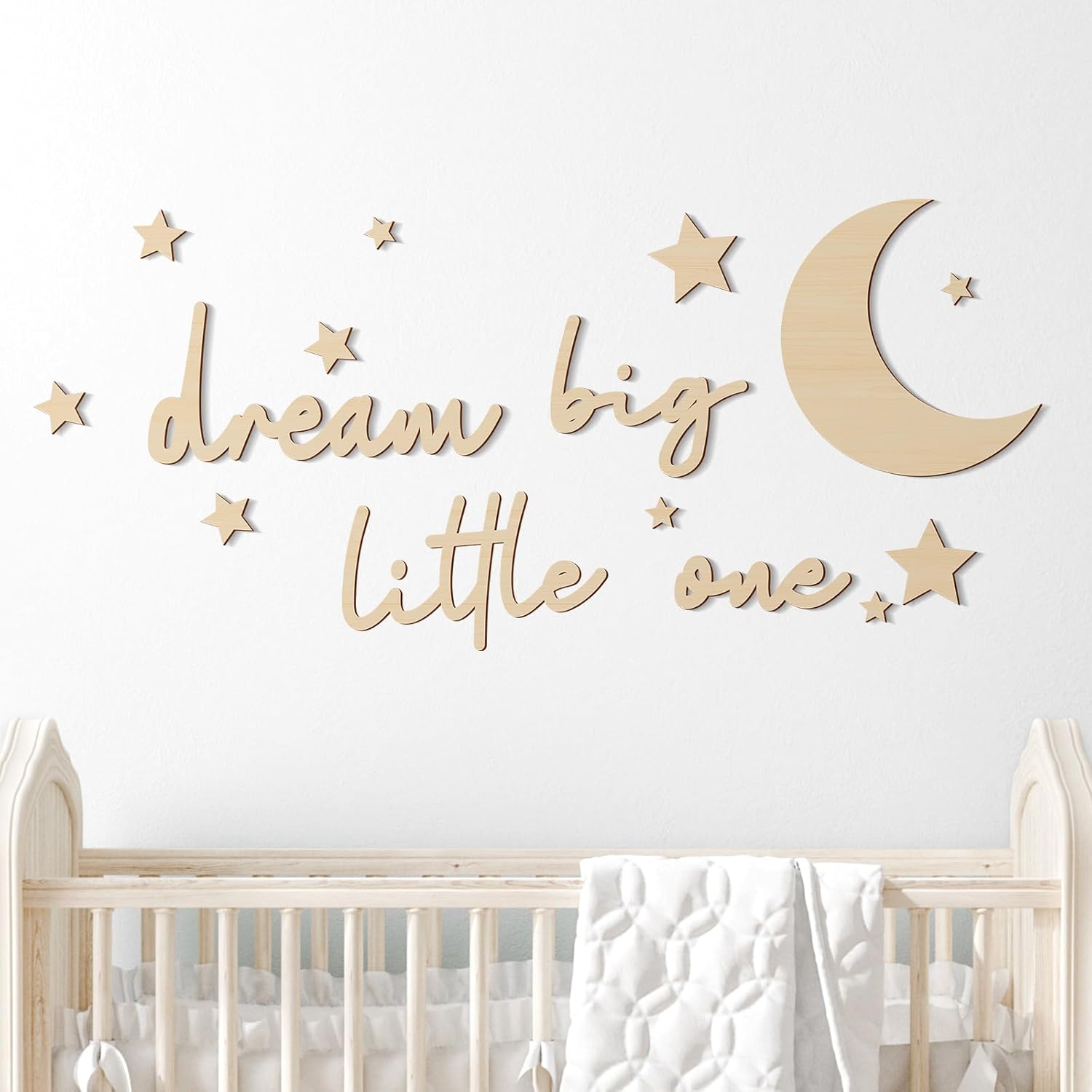 Briwooody 15 Piece Dream Big Little One Wooden Nursery Wall Decor front view showing the complete celestial set on a bedroom wall.