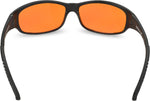 Spectra479 orange tinted glasses resting on a surface