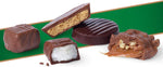 Individually wrapped pieces of sugar free peanut butter cups and pecan delights spread out