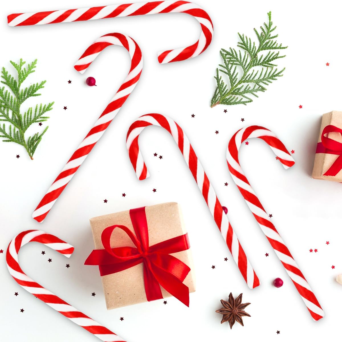 Yumzo holiday candy canes bulk set displayed in its seasonal winter themed two tier gift box packaging.