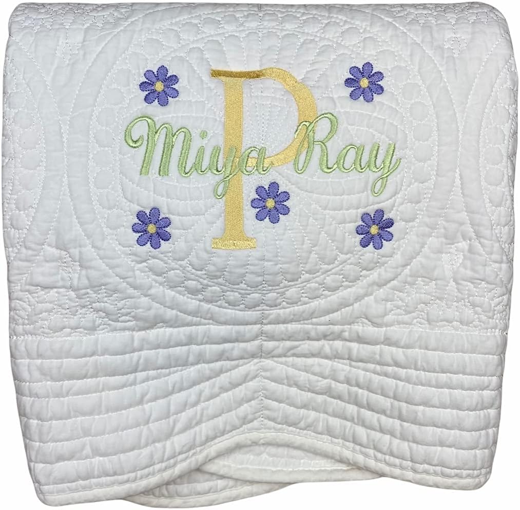 OllieByBeebz personalized baby quilt blanket front view showing white custom name embroidery.