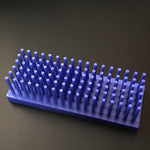 Blue 102-well peg drying rack showing grid layout and durable plastic construction
