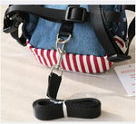 Zippered storage pouch open on small dog backpack harness