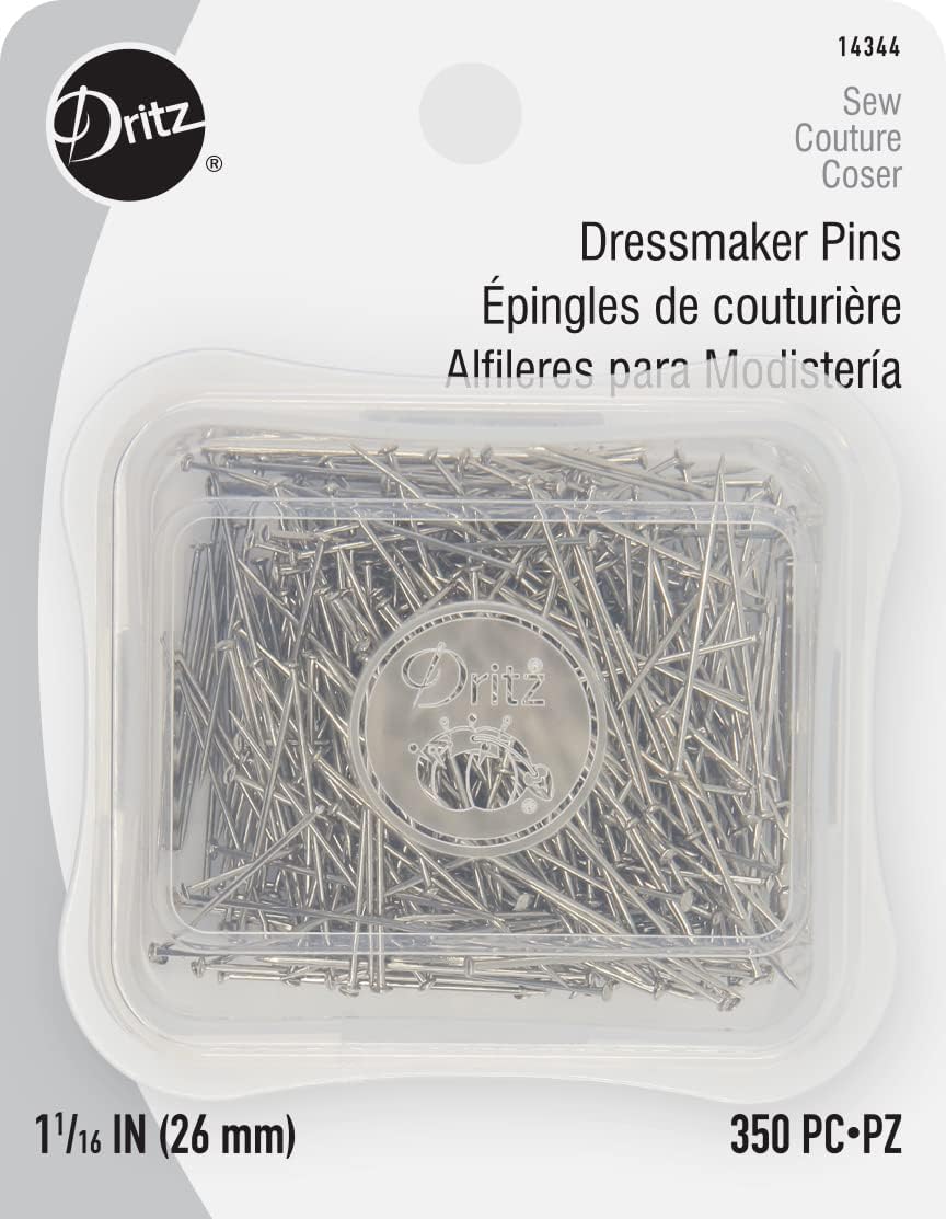 Stackable plastic storage boxes of Dritz garment pins displayed for sewing enthusiasts.