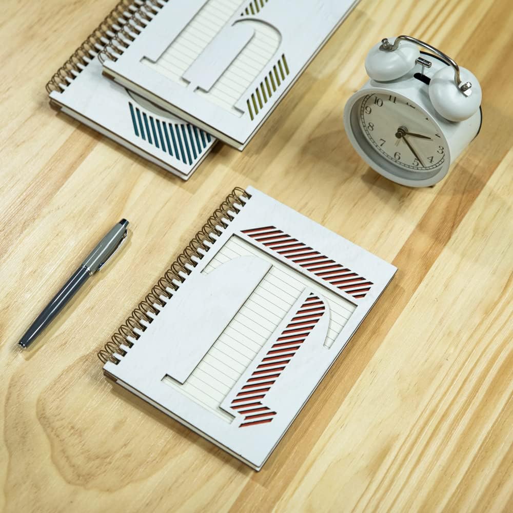 Collective Home Monogram Notebook opened flat on a desk