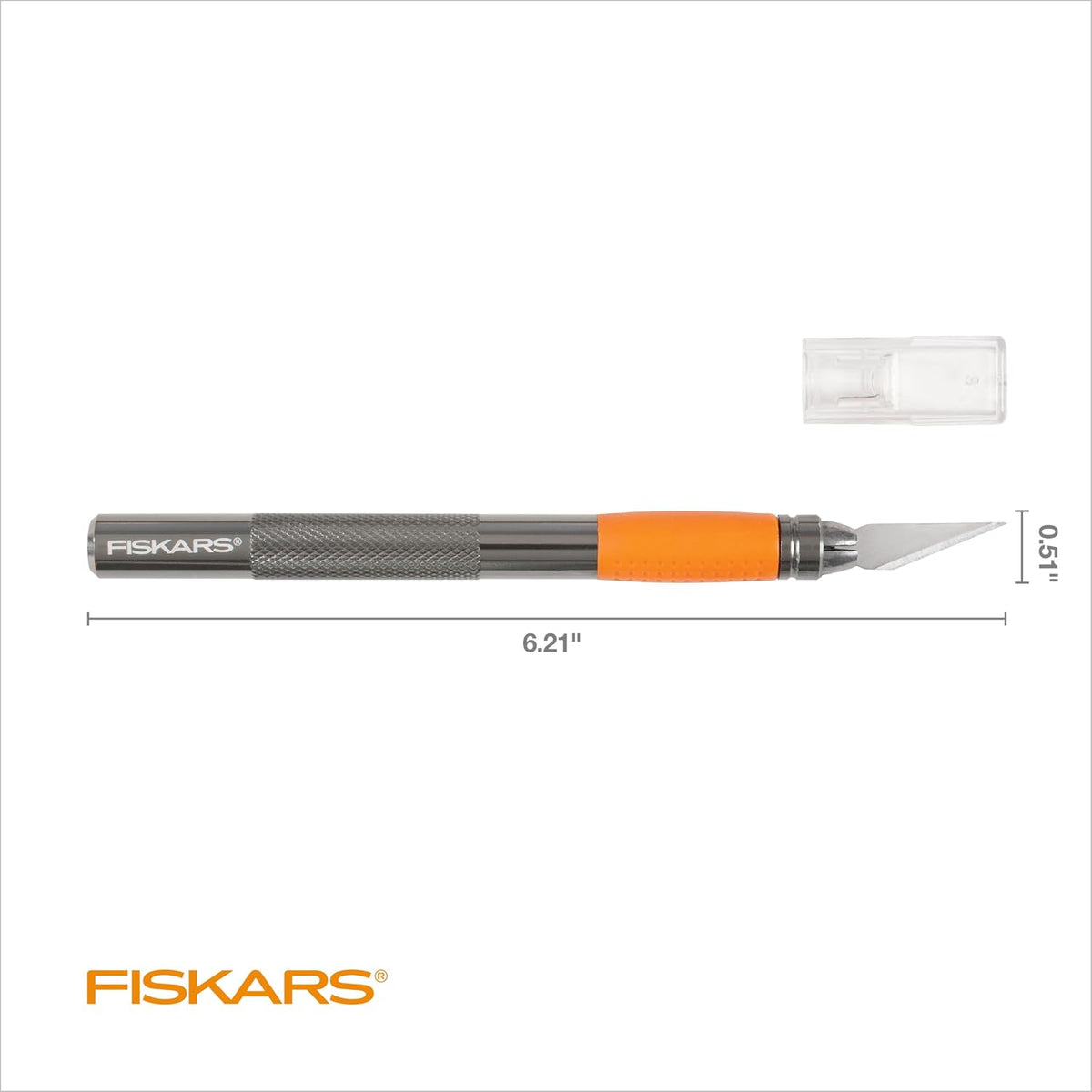Fiskars orange ergonomic craft knife held in hand for detailed scrapbooking