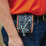 Klein Tools 55895 tool wristband worn on an arm during work.