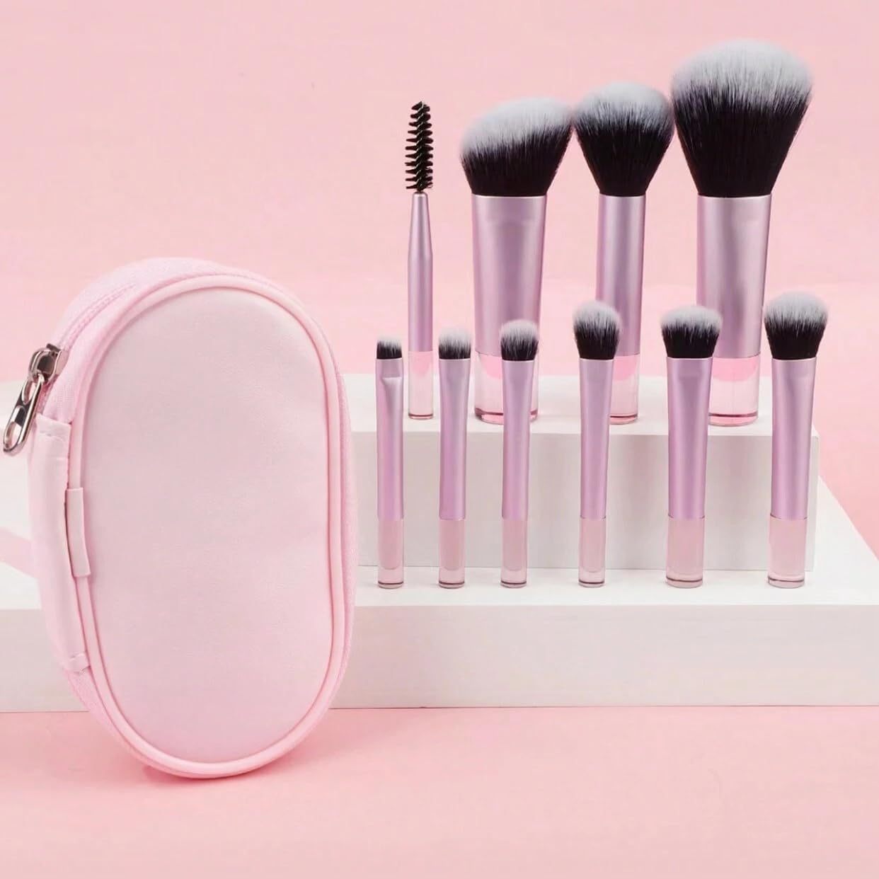 Cilios mini makeup brush set front view showing ten pink travel brushes arranged outside the zipper pouch