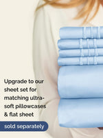 Light blue fitted sheet styled neatly on a California King bed